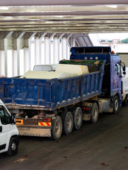 trucks-minibuses-located-inside-ferryboat-greece_1268-15825